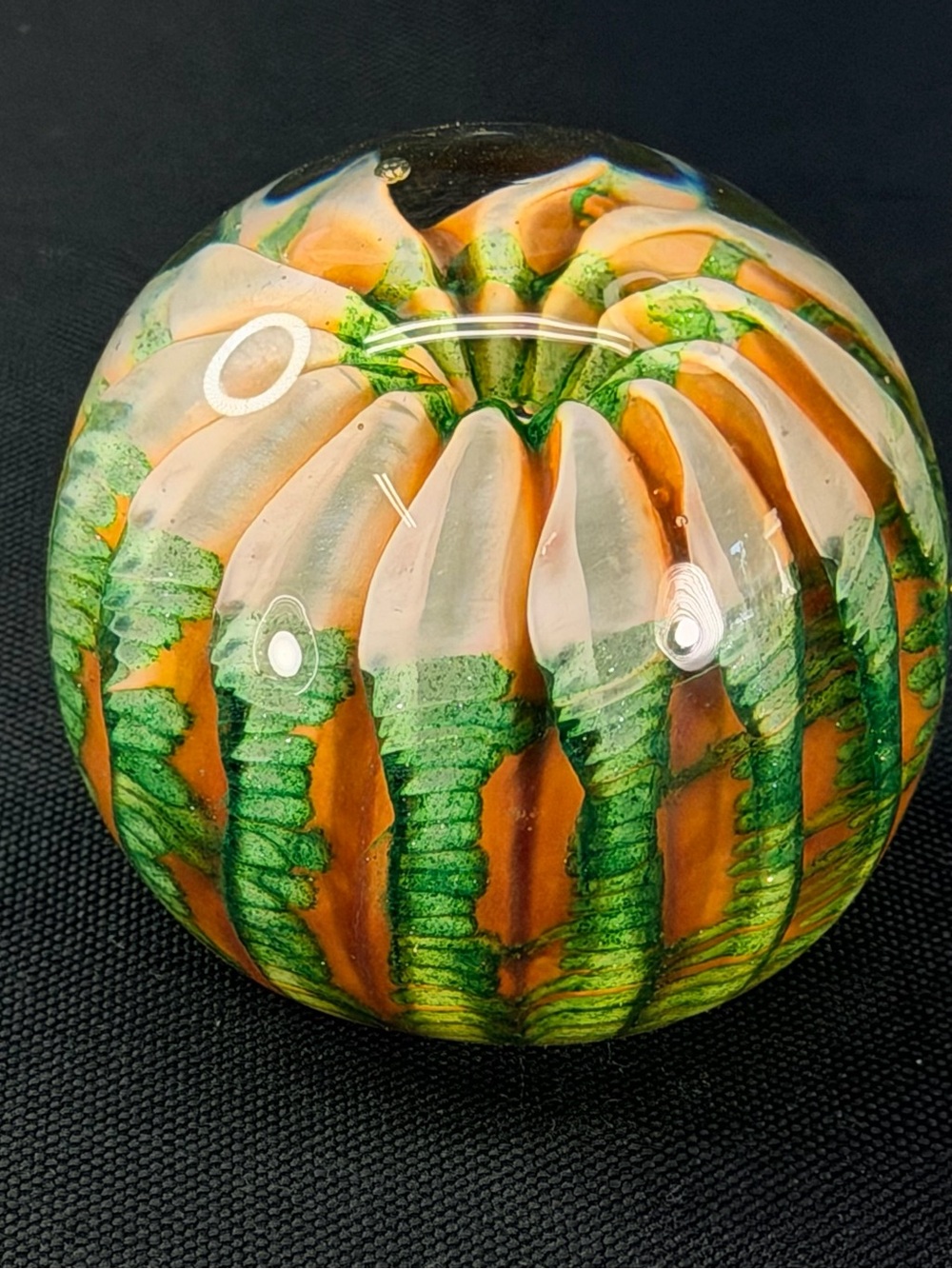 The Glass Forge Paperweight in Green and Orange
